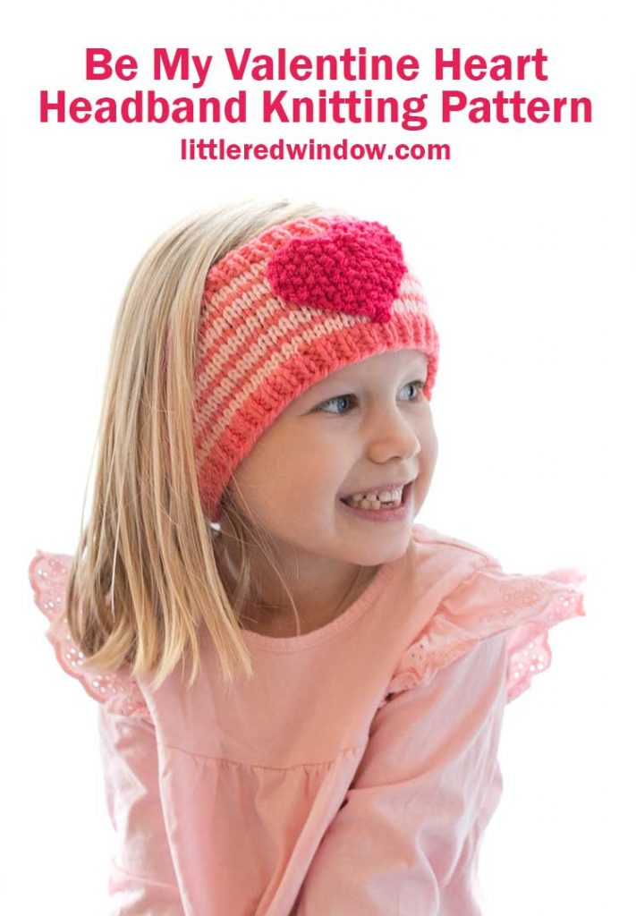 smiling girl wearing heart headband looking far away off to the right