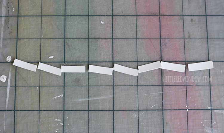 strip of white faux leather cut into one inch lengths to make sprinkles for the birthday cake costume