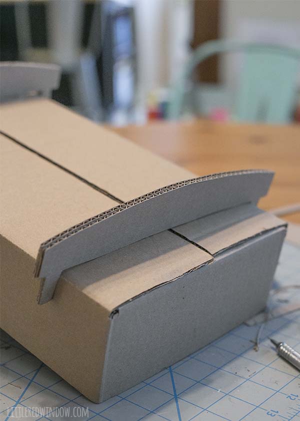 How to make a DIY Doll Crib from an old cardboard box!