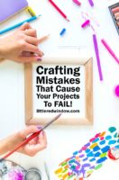 small crafting mistakes overhead view of womans hands holding paintbrush over table of craft supplies