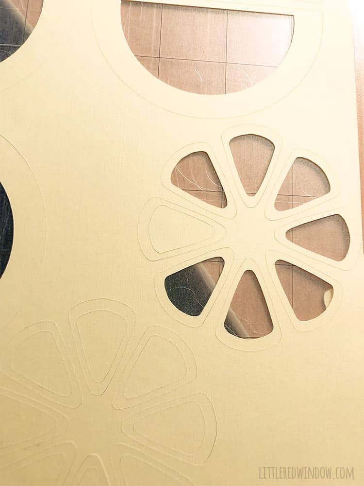 Use a cutting machine like the Silhouette Cameo to cut lemon shapes from scrapbook paper