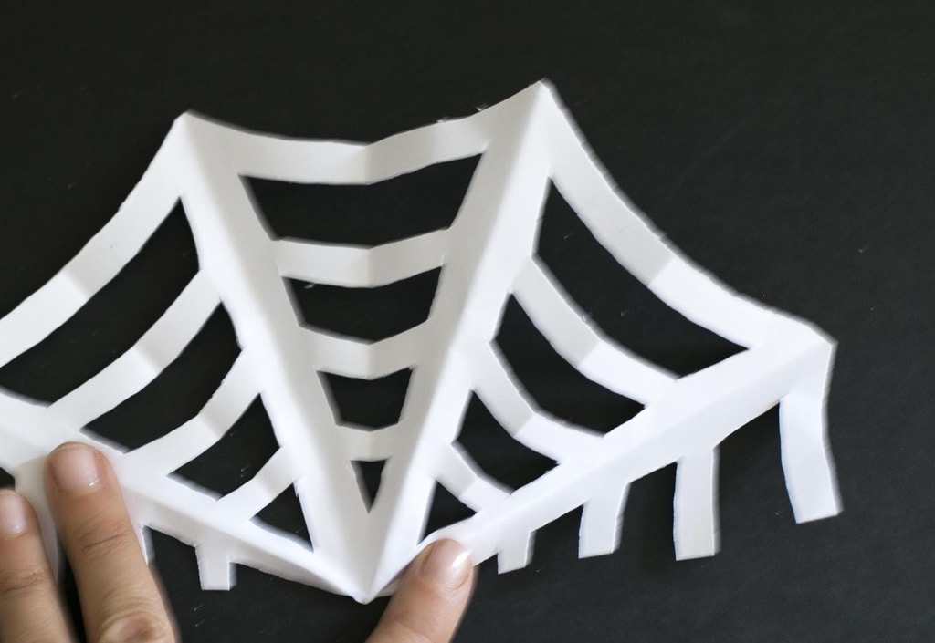paper spider web halfway unfolded