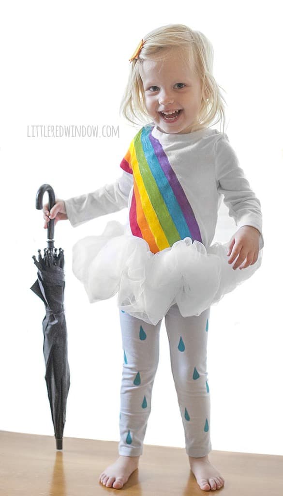DIY Rainbow Costume for Kids! Get instructions to make this adorable costume including rainbow shirt, cloud tutu, raindrop leggins and sun hair clip!