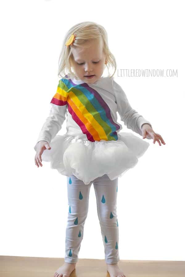 DIY Rainbow Costume for Kids! Get instructions to make this adorable costume including rainbow shirt, cloud tutu, raindrop leggins and sun hair clip!