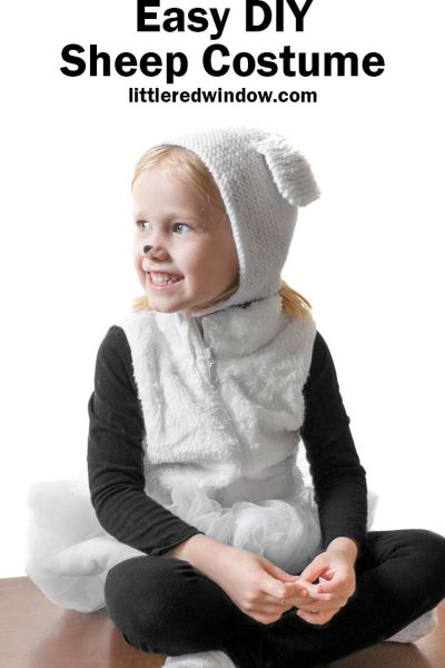 little girl in furry white vest and sheep bonnet with the words easy diy sheep costume in black