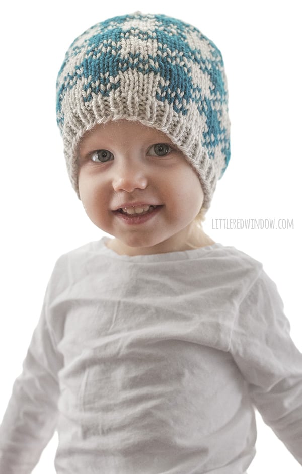 Easy Plaid Hat Knitting Pattern for newborns, babies and toddlers, this is a fun quick knit with and easy plaid pattern that only uses two colors of yarn! | littleredwindow.com