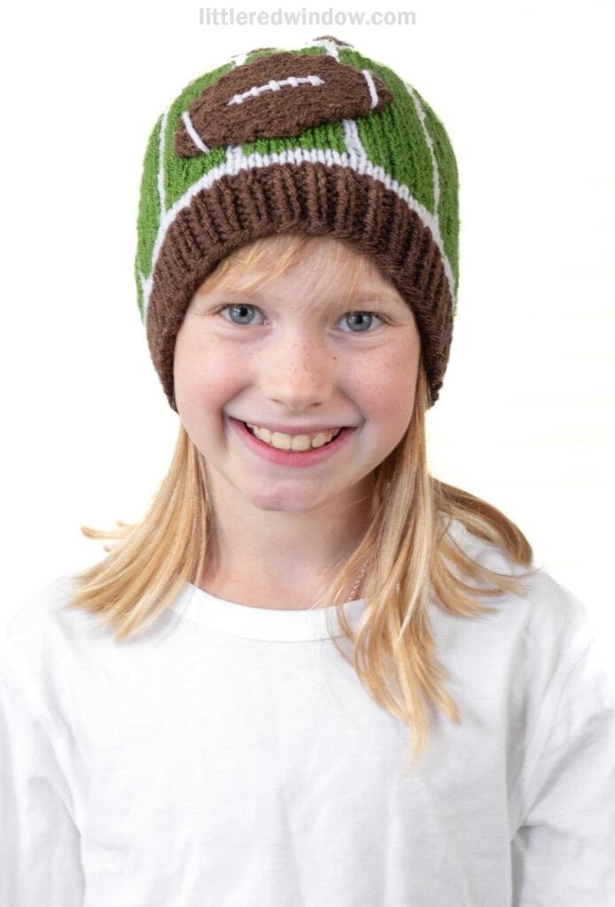 Funny football themed knit hat for kids, cozy and colorful baby girl knit hat with football design, perfect for sports fans and winter wear, Little Red Window.