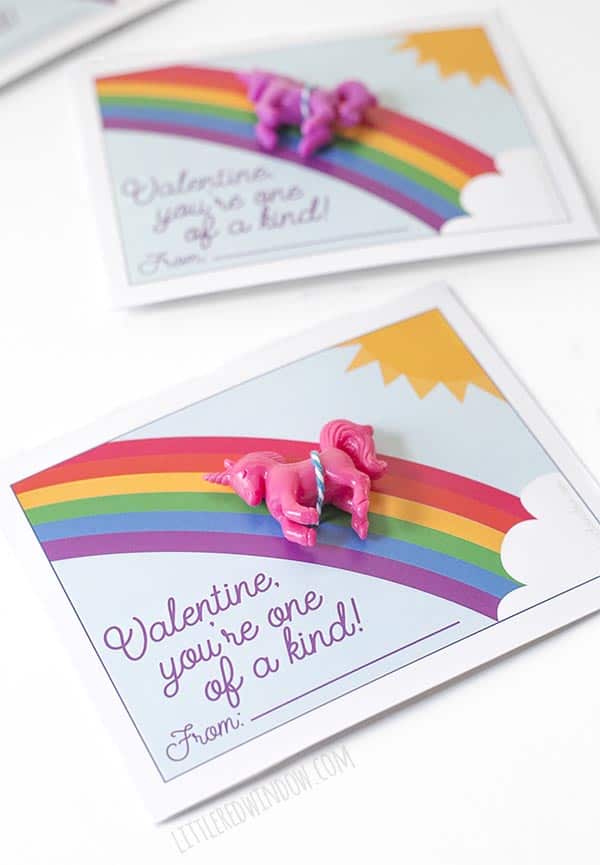 Closeup of free printable unicorn valentine with pink unicorn toy!