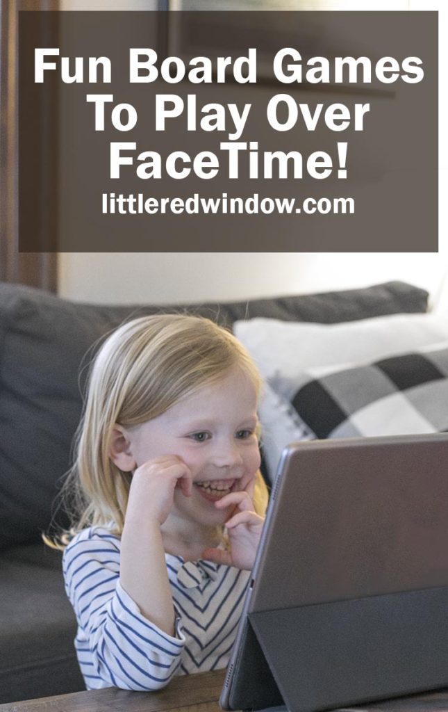 Smiling girl talking to someone on a video screen 