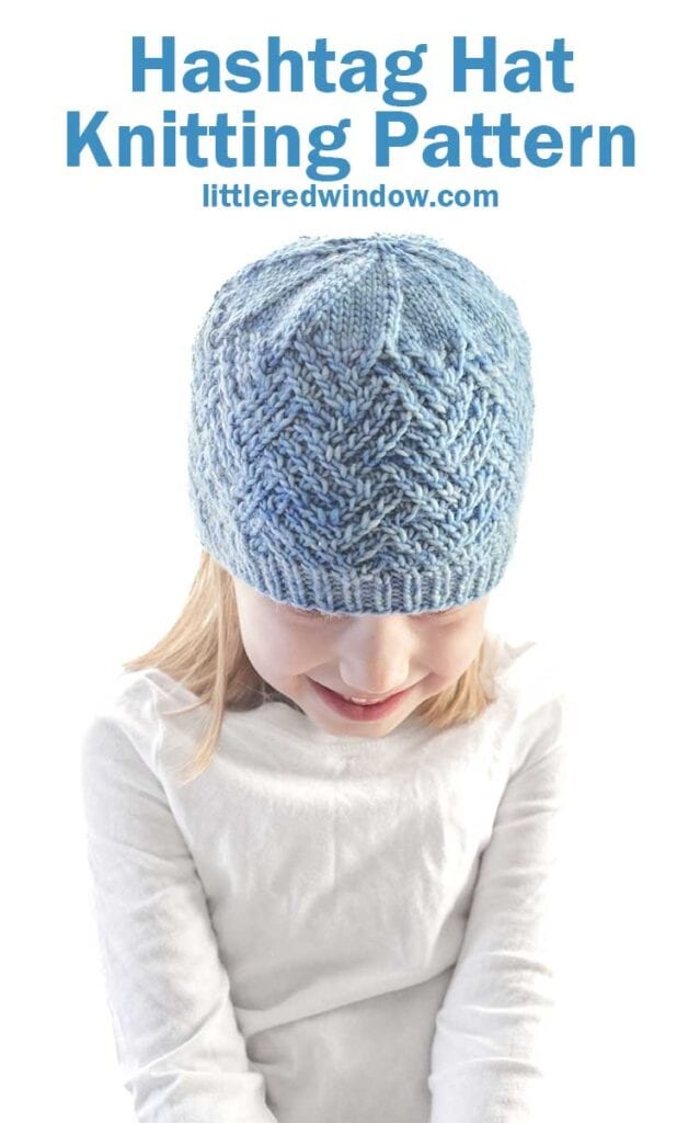 A child in a blue knitted hashtag hat sits against a white background. Above, the text reads 