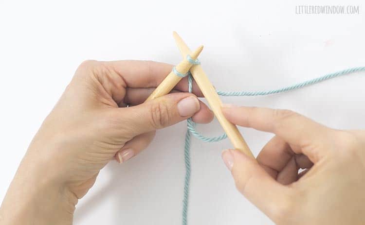 To do a cable cast on, insert the right needle between the first two stitches