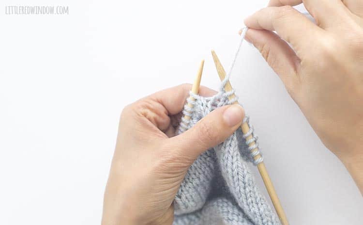 Bring the yarn forward between the knitting needles to do a yarn over