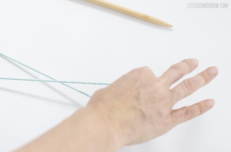 To make a slip knot, twist your hand over and then back around the yarn