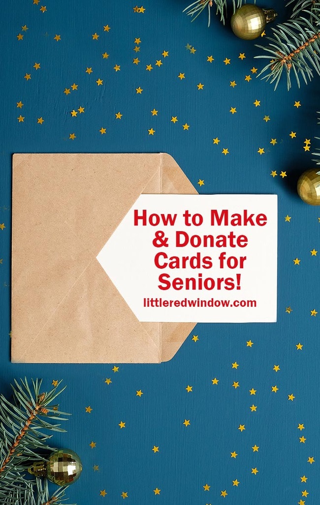 Craft paper envelope letter with blank white card mockup on dark blue background with golden confetti stars, fir branches, Christmas decorations. Christmas letter concept.