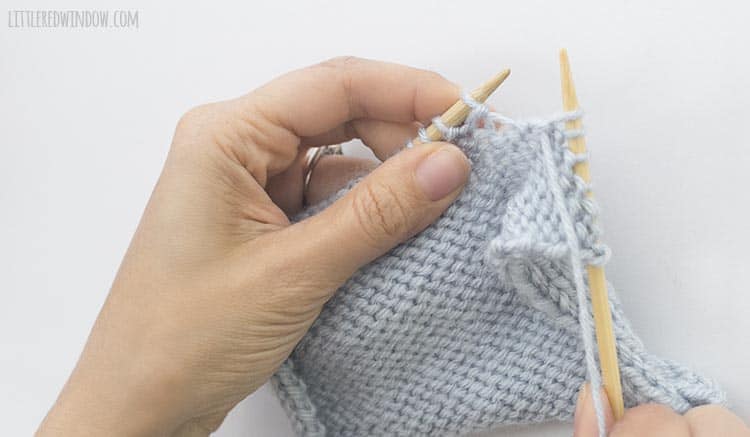 To finish a ptbl stitch, pull the yarn through the original stitch and drop the stitch from the left knitting needle