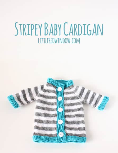 gray and white striped knit baby cardigan with blue trim on a white background