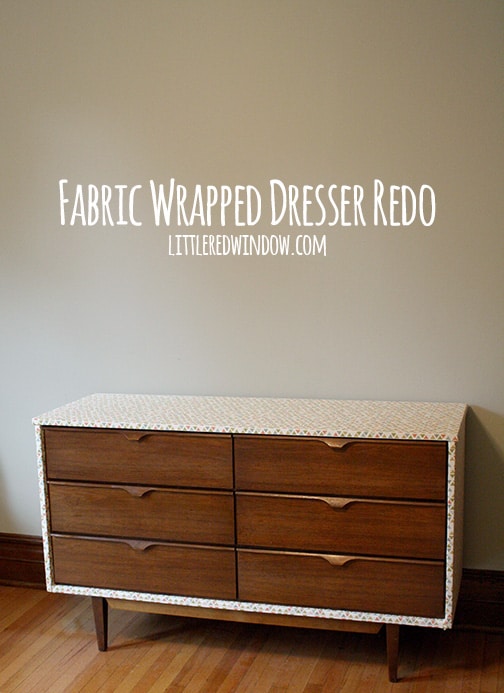 DIY Fabric Wrapped Dresser inside the house in front of a gray wall