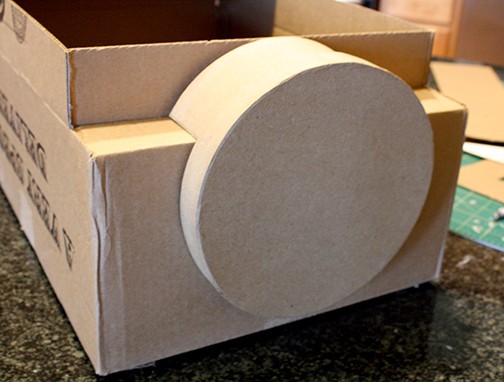 Round cardboard base attached to the front of the train shape