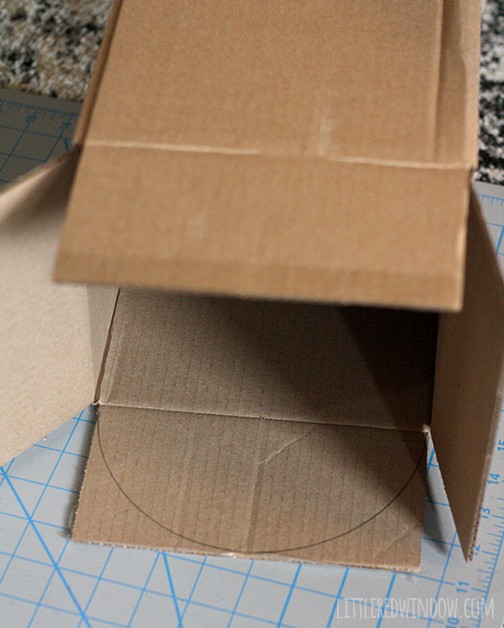 Box with a half circle drawn on one of the top flaps