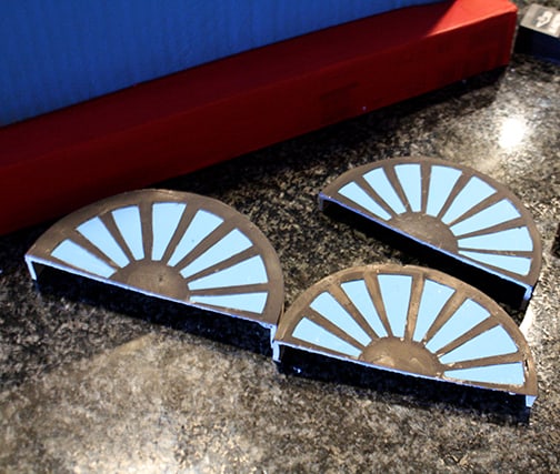 Blue half wheels with black spokes for the train