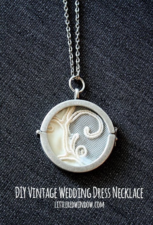 Assembled photo pendant on a silver chain with scrap of wedding dress lace inside