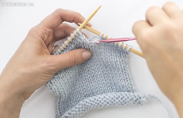 Pull the horizontal yarn through the live stitch