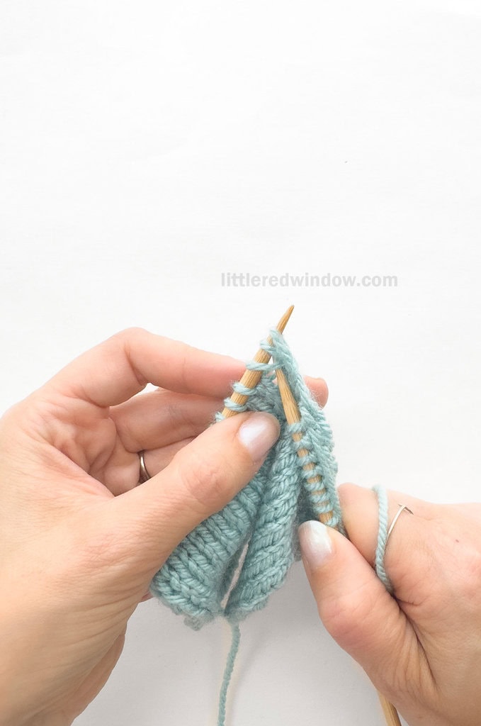 Insert the right needle through the first 3 stitches on your left knitting needle knitwise.