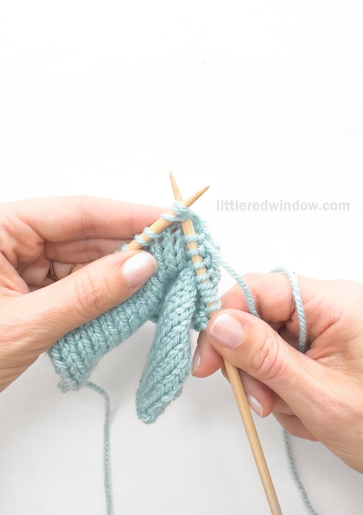 Insert the right needle through the first 3 stitches on your left knitting needle knitwise.