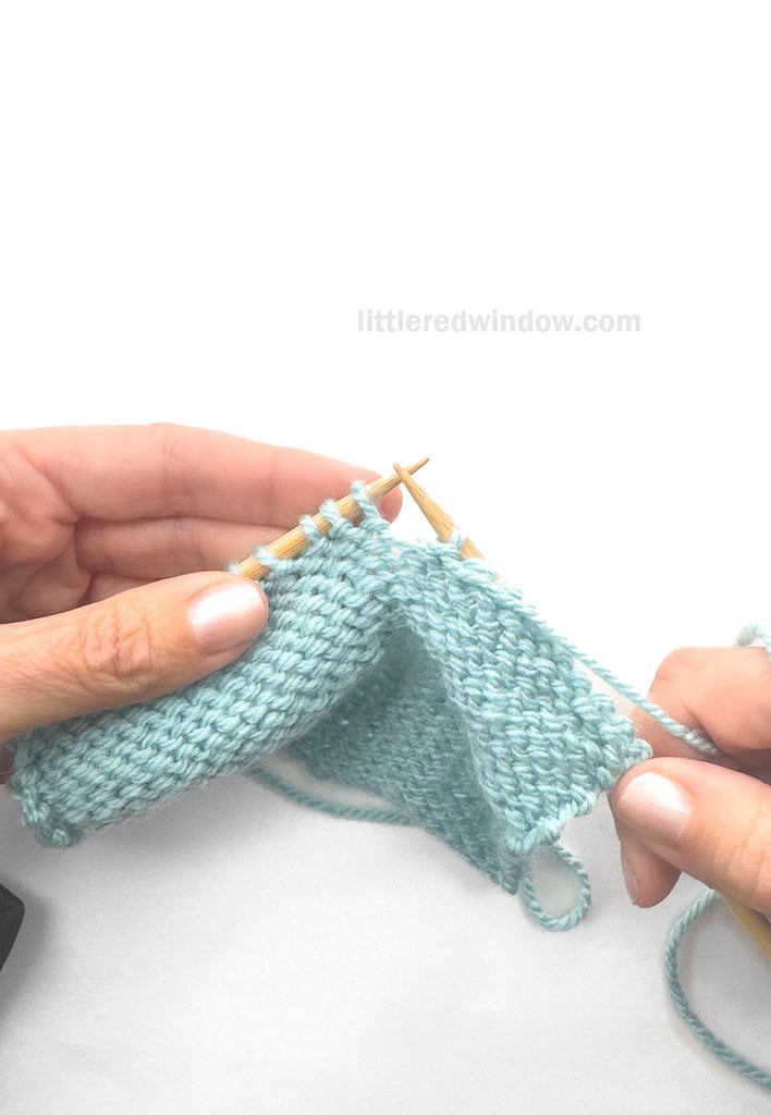 Insert the right knitting needle through the first 3 stitches on the left needle purlwise all at the same time.