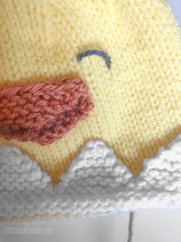 Embroider the cute face on the Little Chick Hat knitting pattern!