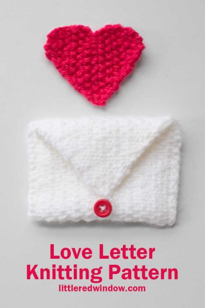 white knit envelope and red knit heart shape on a white background