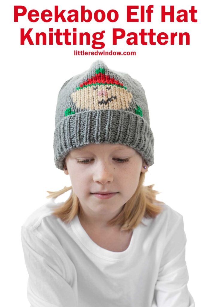 Child wearing a gray knit hat featuring an adorable elf design. Text above reads, 