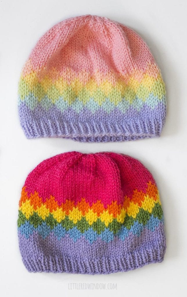 Two versions of the diamond rainbow fade hat knitting pattern one knit in pastel rainbow shades and one knit bright rainbow shades