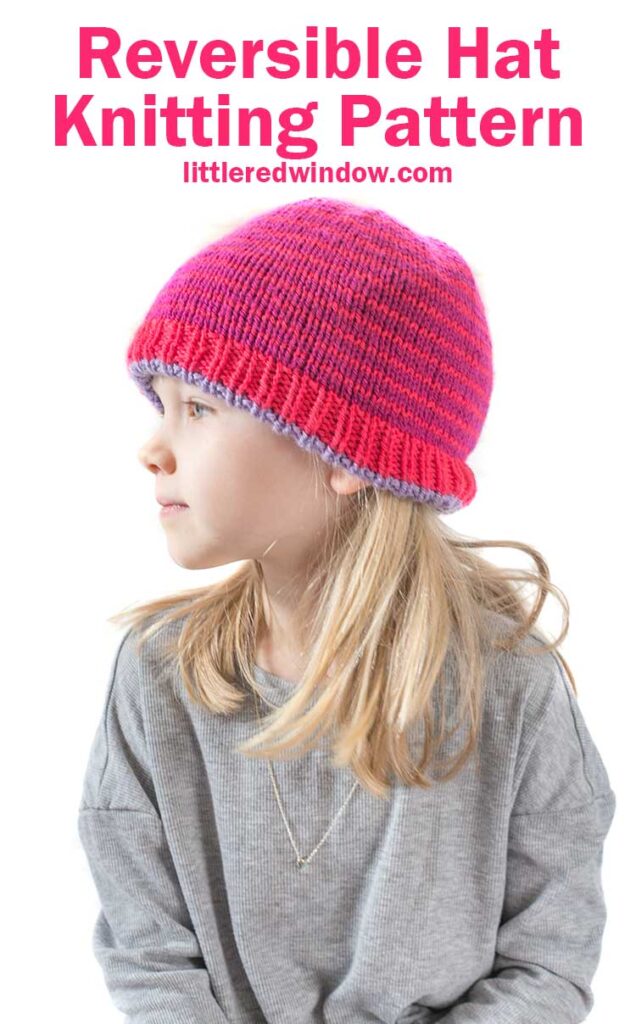 blonde girl in gray shirt looking off to the left wearing a magenta knit hat with thin purple stripes