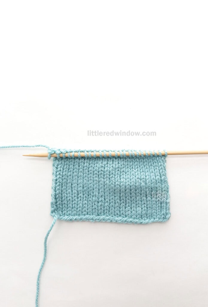 swatch of light blue knitting showing the right side of stockinette stitch