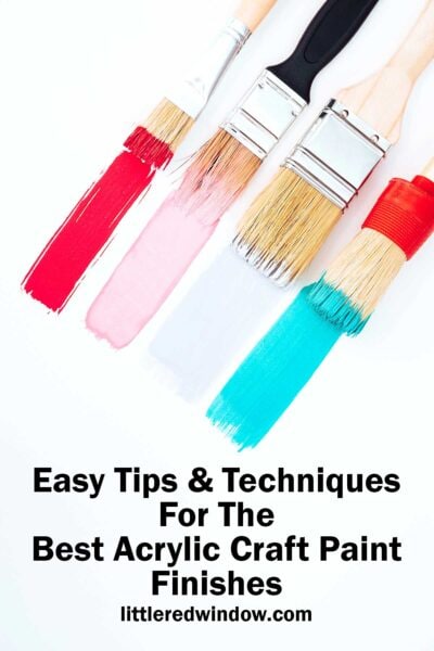 Four paintbrushes with red, pink, white, and blue acrylic craft paint finishes on a white background, with text below reading: "Easy Tips & Techniques For The Best Acrylic Craft Paint Finishes littleredwindow.com".