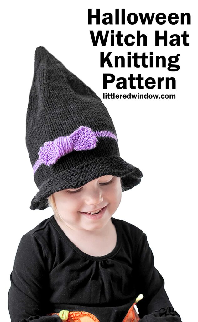 A child wearing a black knitted witch hat with a purple bow smiles while looking down. The text on the image reads 
